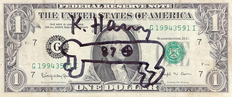 K&ouml;nnte beinhalten: Ein Ein-Dollar-Schein mit einer schwarzen Markierung, die eine cartoonartige Figur &uuml;ber dem Portr&auml;t von George Washington zeigt. Der Schein tr&auml;gt den Text "THE UNITED STATES OF AMERICA" und "ONE DOLLAR". Der Schein ist mit "K. Henry" signiert.