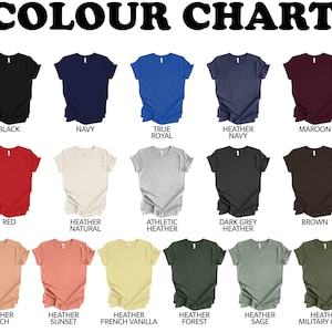 May include: A color chart displaying various t-shirt colors, including white, black, navy, and red. The text "COLOUR CHART" is at the top. Other colors include pink, heather natural, athletic heather, and dark grey heather.