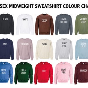 a bunch of sweaters with different sayings on them