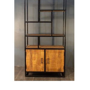 May include: A black metal bookshelf with wooden shelves and two wooden doors. The bookshelf has a geometric design with open shelves and a closed cabinet at the bottom.