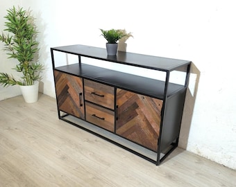 May include: A black metal frame cabinet with two doors and two drawers. The doors and drawers are made of reclaimed wood with a chevron pattern. The cabinet has a shelf on top.