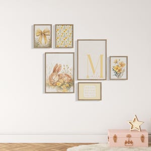 Vintage storybook nursery gallery set with bunny rabbit print, soft yellow flowers, feminine quote artwork, and custom initial wall decor.