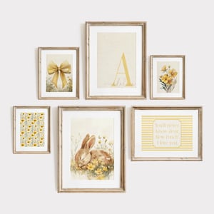 Cottagecore nursery gallery wall set featuring bunny rabbit art, yellow floral prints, personalized initial print, and sentimental nursery quotes.