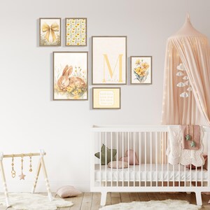 Neutral yellow nursery wall art collection featuring bunny rabbit artwork, floral botanical prints, pastel striped typography, and personalized name initial print.