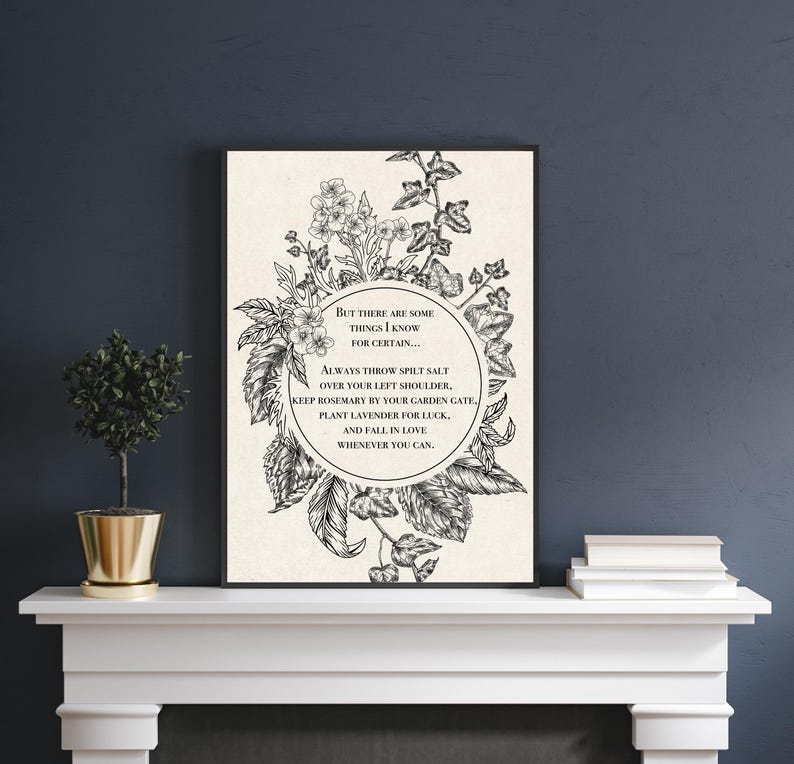 Vintage-inspired black and white botanical illustration featuring flowers and leaves framing a circular quote. The text inside reads: "But there are some things I know for certain… Always throw spilt salt over your left shoulder, keep rosemary by your garden gate, plant lavender for luck, and fall in love whenever you can." The artwork has an old-world, mystical feel, reminiscent of traditional herbal folklore or a page from an apothecary book.