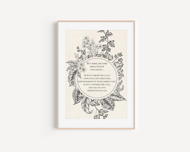Vintage-inspired black and white botanical illustration featuring flowers and leaves framing a circular quote. The text inside reads: "But there are some things I know for certain… Always throw spilt salt over your left shoulder, keep rosemary by your garden gate, plant lavender for luck, and fall in love whenever you can." The artwork has an old-world, mystical feel, reminiscent of traditional herbal folklore or a page from an apothecary book.