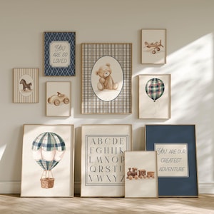 May include: A set of framed art prints with a nursery theme. Prints feature a teddy bear, hot air balloon, airplane, alphabet, and the phrases "You Are So Loved" and "You Are Our Greatest Adventure."