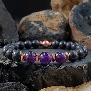 May include: A black onyx bracelet with three amethyst beads and copper accents.