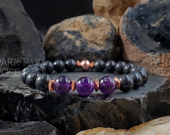 May include: A black onyx bracelet with three amethyst beads and copper accents.