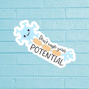 May include: A light blue sticker featuring a cartoon neuron with a smiling face. The sticker has the text "Don't waste your POTENTIAL" in black and white. The sticker is on a light blue brick wall.