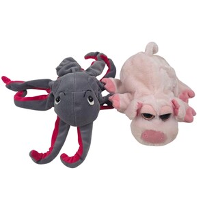 May include: Two plush toys consisting of a dark gray octopus with bright pink undersides on its tentacles and a light pink pig with darker pink accents on its snout, ears, and hooves. Both stuffed animals feature large, expressive eyes.