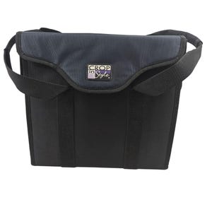 May include: Black tote bag with a dark blue flap and handles. The bag has a rectangular shape with a top flap that folds over. The text "Crop in Style" is visible on the front of the bag.