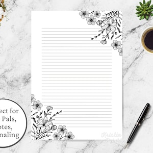 May include: Printable lined stationery paper with black floral corner designs. The paper is perfect for writing letters, notes, or journaling.