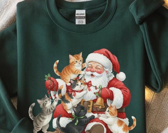 Sudadera navideña con gatos y Papá Noel. Lindo regalo navideño para amantes de los gatos. Camiseta vintage de los 90. Camiseta retro navideña. Cuello redondo para mujer.