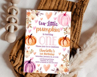 May include: A birthday invitation with the text "Our Little Pumpkin is turning ONE." The invitation features watercolor pumpkins, hearts, and floral accents. The invitation is on a brown background with a wooden rattle.