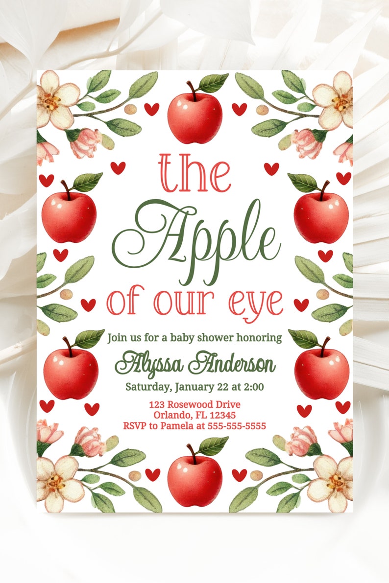 May include: A baby shower invitation with a red apple and green leaves, with the text "the Apple of our eye" and the name "Alyssa Anderson".