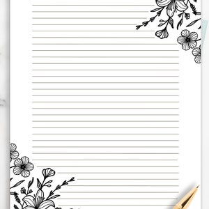 May include: Black and white floral design on a white background with lined paper. The design features flowers, leaves, and stems.