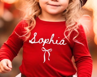 Camiseta con nombre personalizado para niña, camiseta con nombre para niña pequeña, camiseta con lazo coqueto, camiseta con nombre personalizado, regalo de cumpleaños para niña pequeña, camiseta con lazo preppy para niños
