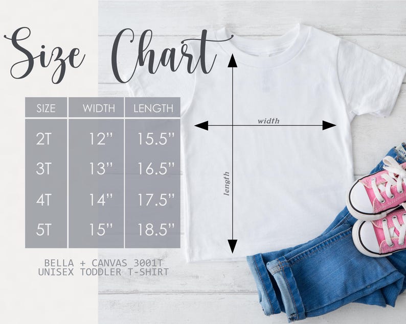 May include: A white unisex toddler t-shirt with a size chart. The chart shows sizes 2T to 5T, with corresponding width and length measurements in inches. The shirt is paired with blue jeans and pink sneakers.