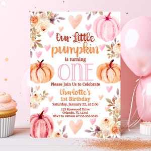 May include: A watercolor-style invitation for a first birthday. The design features pumpkins, hearts, and floral accents in shades of pink, peach, and cream. Text reads "Our Little Pumpkin is turning ONE." Includes party details.