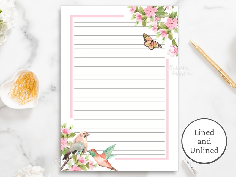 May include: Printable lined and unlined stationery featuring a pink floral border with a butterfly, bird, and hummingbird. The paper is white with black lines.