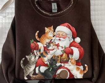 Sudadera navideña con gatos y Papá Noel. Lindo regalo navideño para amantes de los gatos. Camiseta vintage de los 90. Camiseta retro navideña. Cuello redondo para mujer.