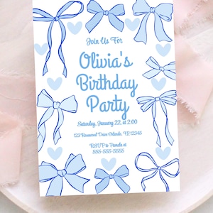 May include: A white invitation card with blue bows and hearts. The text reads "Join Us For Olivia's Birthday Party" with date, time, address, and RSVP information. The design features hand-drawn style bows.