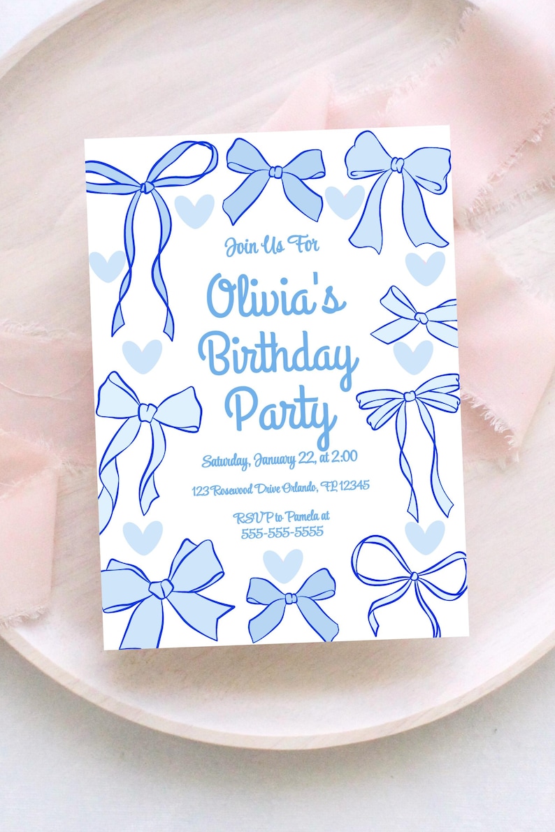 May include: A white invitation card with blue bows and hearts. The text reads "Join Us For Olivia's Birthday Party" with date, time, address, and RSVP information. The design features hand-drawn style bows.