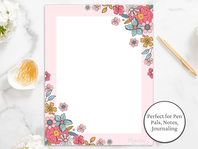 May include: Pink printable stationery paper with a floral border design in shades of pink, blue, and yellow. The text "Perfect for Pen Pals, Notes, Journaling" is at the bottom right corner.