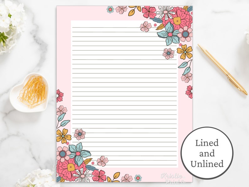 May include: Pink lined and unlined printable stationery paper with a floral border. The border features pink, blue, and yellow flowers.