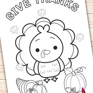 May include: A black and white coloring page featuring a cartoon turkey with a pumpkin and a cornucopia. The text "Give Thanks" is at the top of the page.