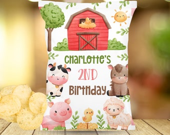 May include: A white chip bag with a farm theme. The bag features a red barn, a cow, a pig, a sheep, a chick, and a sun. The text on the bag reads "Charlotte's 2nd Birthday".