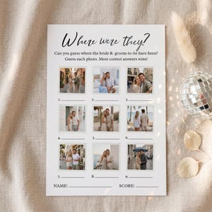 May include: A white paper game with the text "Where were they?" and nine photo spaces. The game asks players to guess where the bride and groom-to-be have been. The game includes spaces for the player's name and score.