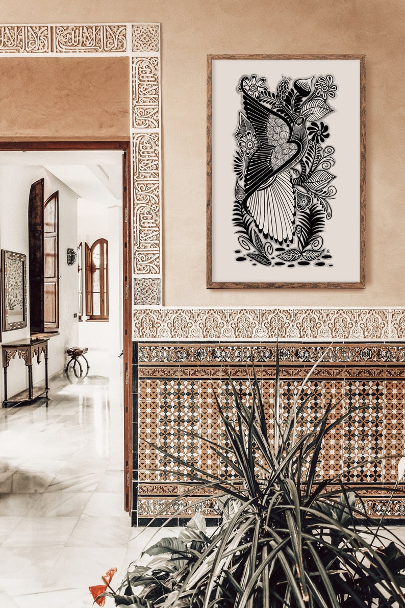 May include: A black and white line art print of a bird with intricate floral details, framed in a light wood frame and hanging on a beige wall with brown and white patterned tile.