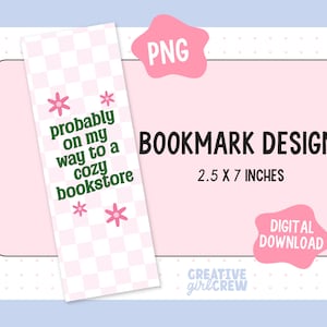 May include: A pink and white checkered bookmark with green text that reads "probably on my way to a cozy bookstore" and pink flowers. The bookmark is 2.5 inches by 7 inches.
