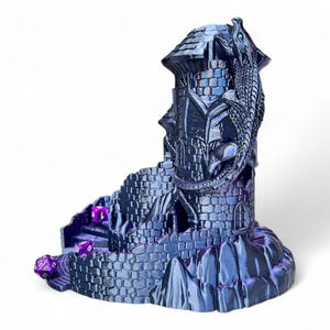 May include: A 3D printed dice tower shaped like a stone tower with a dragon wrapped around it. The tower has a purple iridescent finish and is designed to hold dice for tabletop games.
