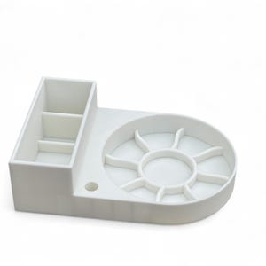 May include: White plastic organizer with a divided compartment and a circular tray with multiple sections.