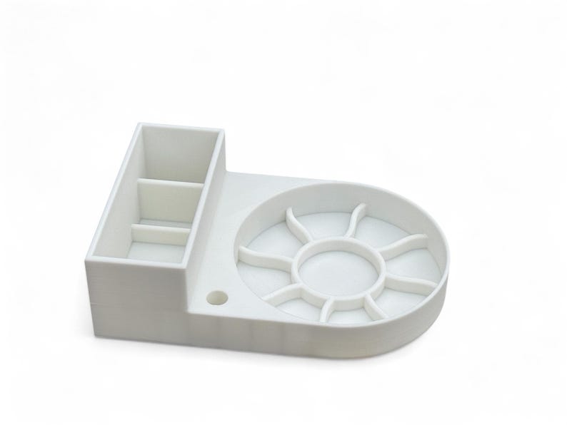 May include: White plastic organizer with a divided compartment and a circular tray with multiple sections.