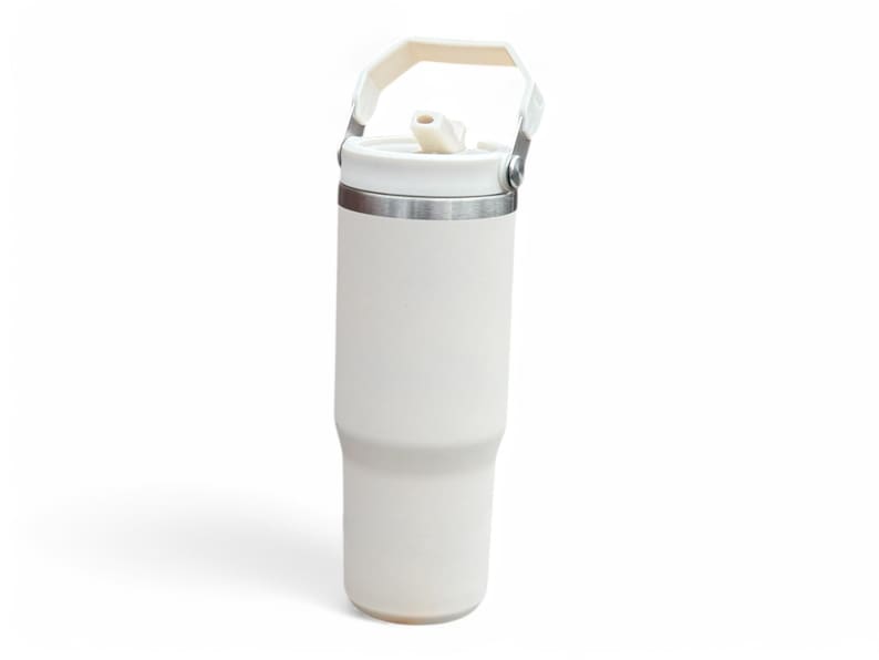 May include: White insulated travel mug with a handle and a straw lid.