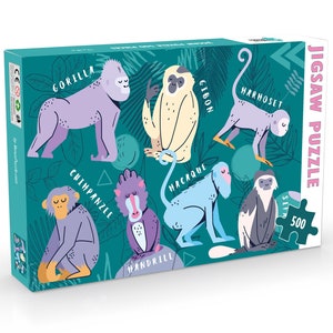 May include: A colourful jigsaw puzzle box featuring illustrations of different types of monkeys, including a gorilla, chimpanzee, gibbon, mandrill, macaque, and a harnessed monkey. The box is green with a pink and white jigsaw piece design and the text "JIGSAW PUZZLE 500".