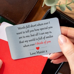May include: A silver metal card with a romantic message that reads "Words fall short when ever I want to tell you how special you are to me, but all I can say is, that my world is full of smiles when ever I think of you. Love Maisie x".