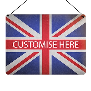 May include: Rectangular sign displaying the Union Jack flag with a distressed effect. A red band across the center features the white text "CUSTOMISE HERE". The sign is designed for hanging, with a black string attached.