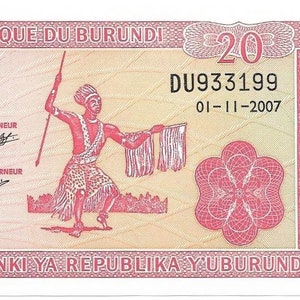 May include: A twenty Franc banknote from Burundi featuring a red and white design with the text "VINGT FRANCS AMAFRANGA MIRONG'IBIRI" and the serial number "DU933199".