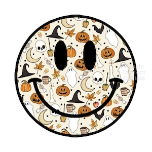 May include: A black and white smiley face with a Halloween-themed pattern. The pattern includes pumpkins, ghosts, witches' hats, stars, candy corn, and moons.