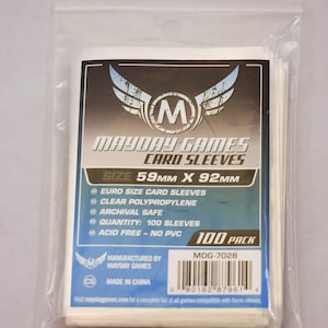 May include: Clear plastic card sleeves in a sealed bag. The packaging features the Mayday Games logo and text indicating the sleeves are Euro size, 59mm x 92mm, made of clear polypropylene, and contain 100 sleeves. The sleeves are archival safe and acid-free.