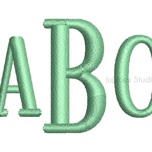 May include: Embroidered letters A, B, and C in a light green color. The letters are stitched together to form the word "ABC".
