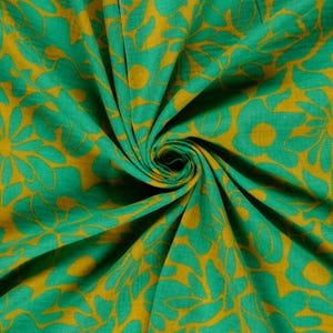 May include: Close-up of a fabric with a repeating floral pattern. The design features large, stylized flowers in shades of green and gold. The fabric is gathered, creating a swirling effect that highlights the pattern's details. The overall aesthetic is vibrant and eye-catching.