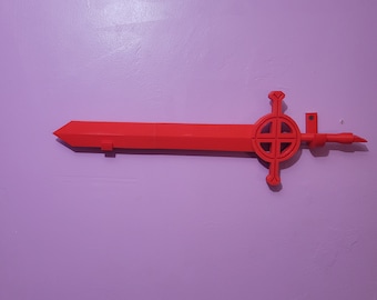 May include: A red plastic sword with a circular design on the hilt, mounted on a wall.