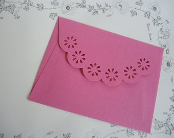 pink envelope with a flower cut-out