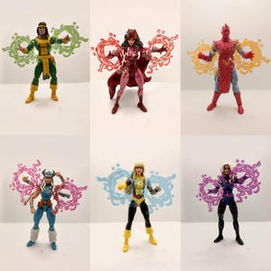 May include: A collection of six articulated action figures, each featuring translucent plastic energy effects attached to their hands. The figures display various costumes in green, red, blue, yellow, and purple, with distinct head sculpts and accessories.